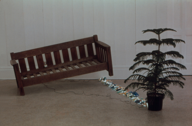 A site specific installation by Harry Anderson whose elements consisted of a mission oak couch, a florescent bulb (on the floor and covered with the broken Fiesta) and a potted palm. Oct. 1972   Anderson Gallery, Virginia Commonwealth University, Richmond, VA