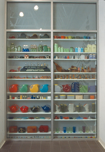 Anderson created a display case out of some interior windows in the gallery to display a selection of items he collects