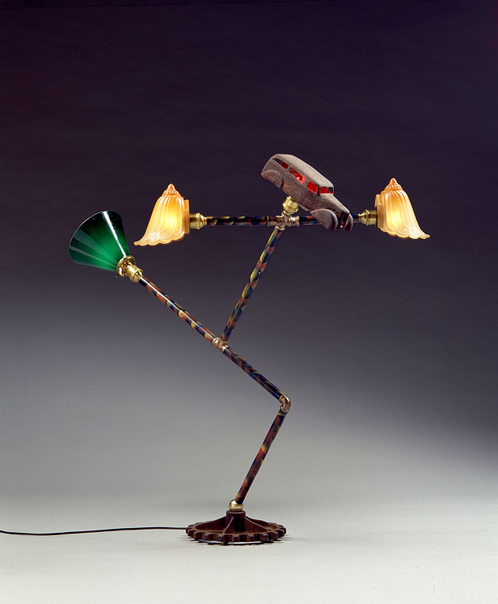 I Roll is a sculpture lamp by artist Harry Anderson that takes the form of a running man