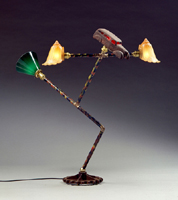 This image of I Roll is one of Harry Anderson's stickman lamps and a link to a selection of art works created by Anderson in the years from 1995 to 1999