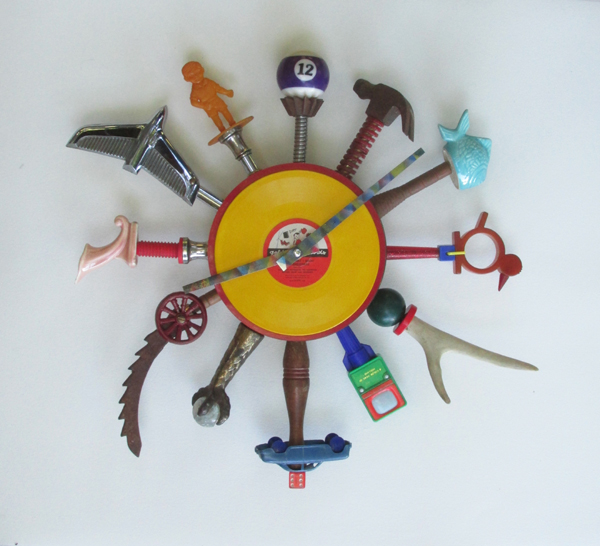 A wall piece in the form of a clock made from found objects by Harry Anderson.